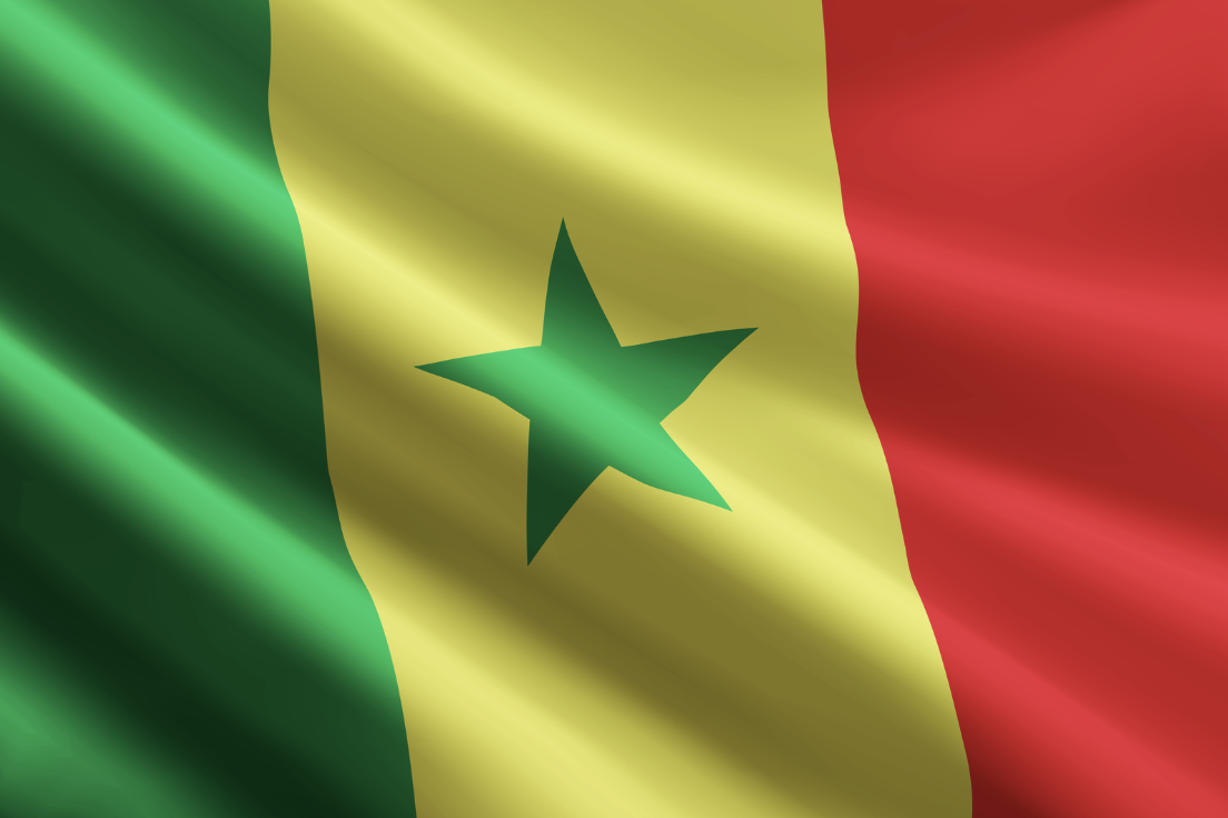 Detailed close-up of the vibrant Senegal flag waving with texture visible.